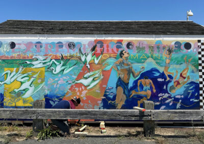 Colorful mural on the side of a trap shed located on the pier in Provincetown MA